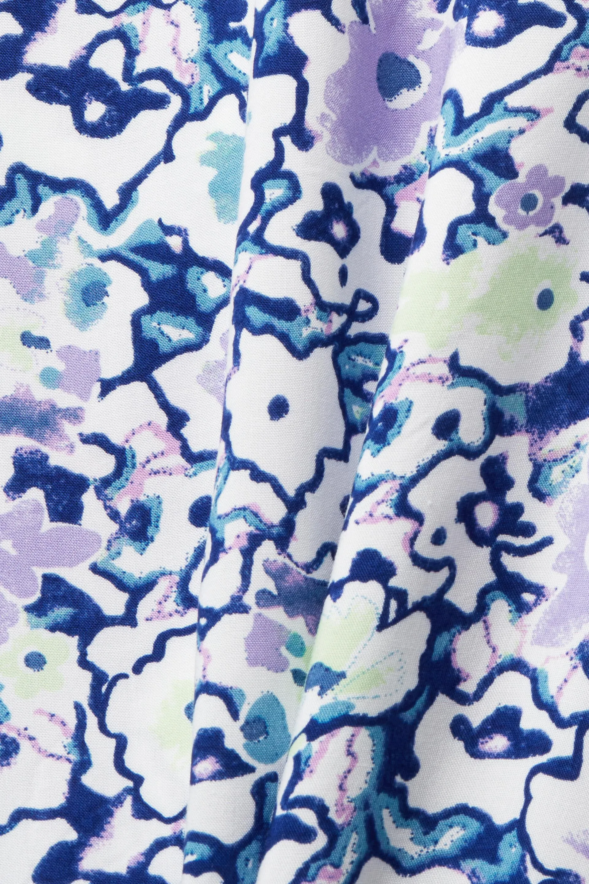 Camicetta floreale con scollo con spacco